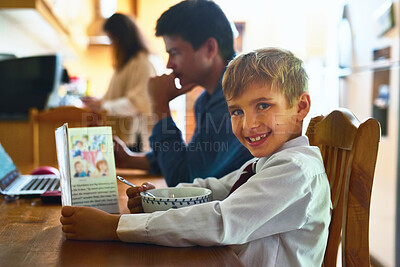 Buy stock photo Portrait, child and book in home with breakfast for reading or learning with morning routine and quality time with family. Boy, happiness and cereal for nourishment and story book for literature.