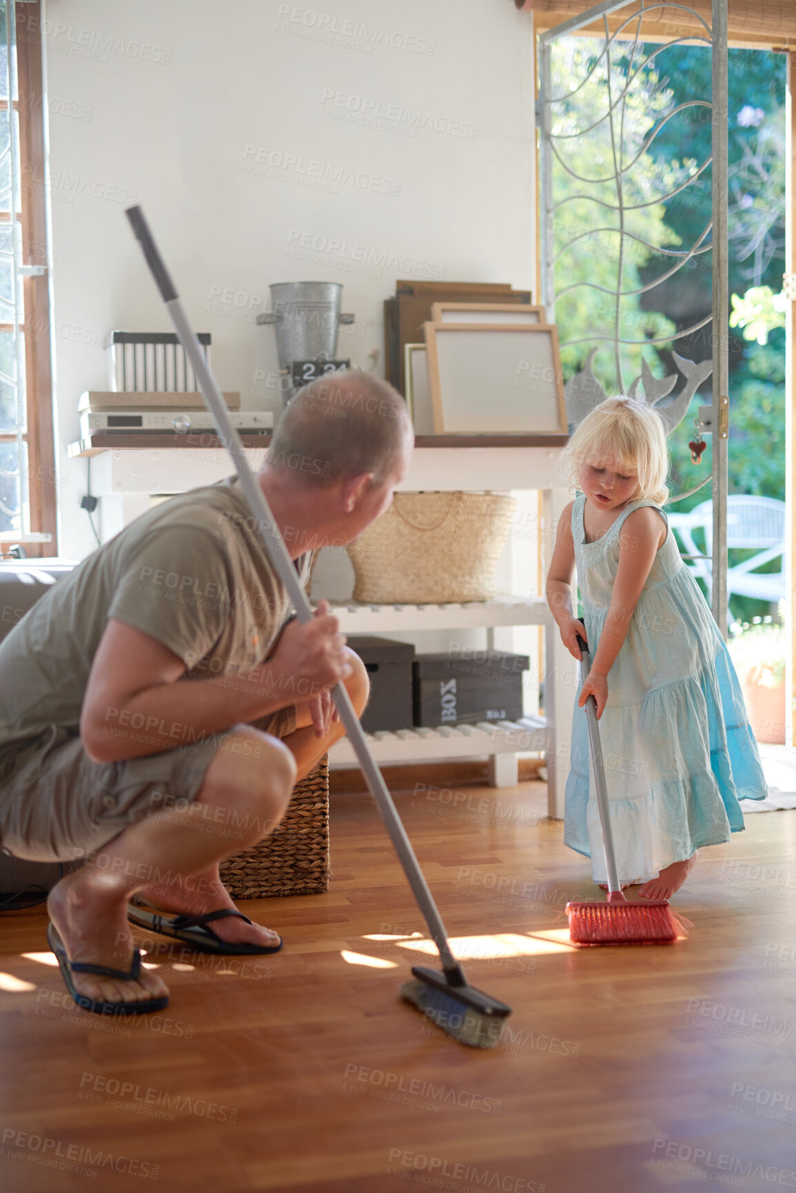 Buy stock photo Father, daughter and broom for sweeping in home, helping and learn to clean for housework. Daddy, girl and bonding for hygiene or responsible housekeeping, dust and routine service for parenting