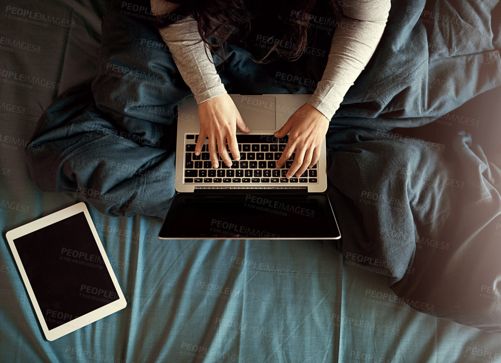 Buy stock photo Laptop, tablet and hands typing on bed for research on creative project with book article online. Bedroom, person and female copywriter working on computer and digital technology from above at home.