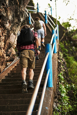 Buy stock photo Hiking, walking and men on stairs on mountain for travel, adventure or exploring in nature. Backpack, outdoor and male people trekking on steps, trail or path for fitness exercise on weekend trip.