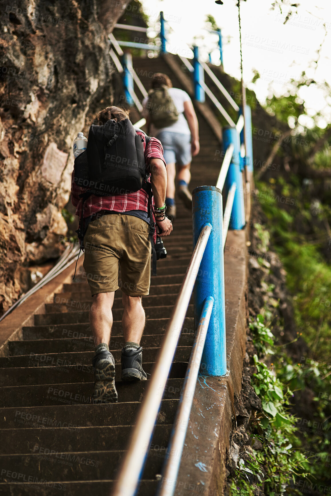 Buy stock photo Hiking, walking and men on stairs on mountain for travel, adventure or exploring in nature. Backpack, outdoor and male people trekking on steps, trail or path for fitness exercise on weekend trip.