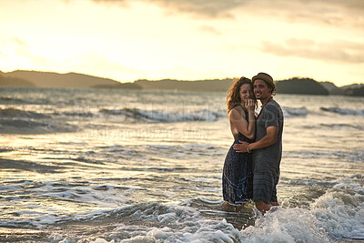 Buy stock photo Sunset, couple and hug in ocean portrait, support and travel to Bali for tropical vacation at sea. People, embrace and connection in outdoor nature, love and bonding together for holiday in water