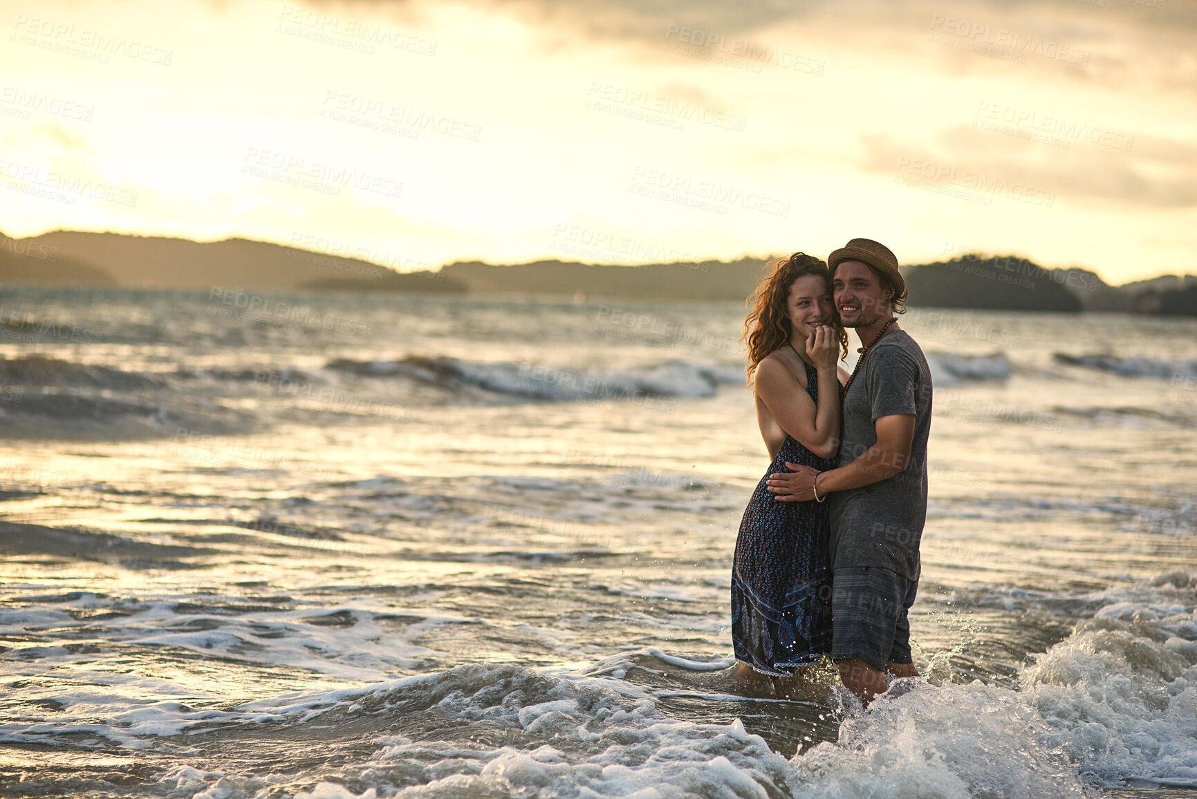 Buy stock photo Sunset, couple and hug in ocean portrait, support and travel to Bali for tropical vacation at sea. People, embrace and connection in outdoor nature, love and bonding together for holiday in water