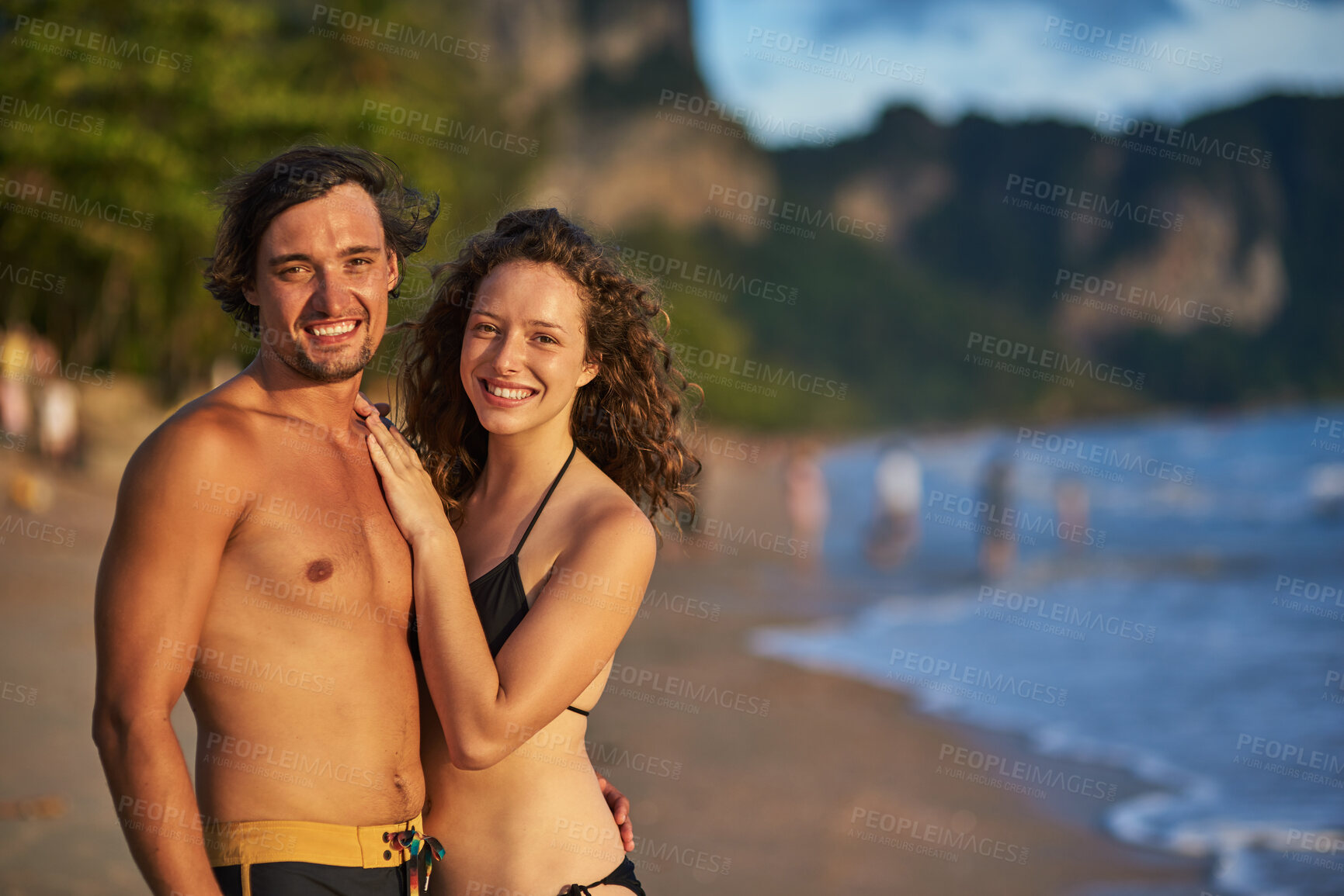 Buy stock photo Portrait, couple and hug at beach on vacation, swimwear and travel to Bali a tropical island for sea. People, relax and embrace for support in outdoor nature, love and together for holiday by ocean