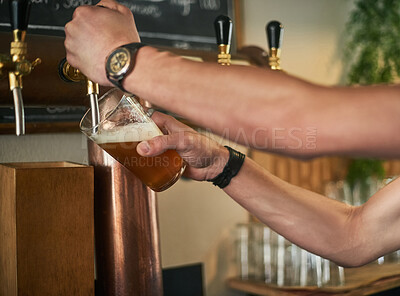 Buy stock photo Beer, draft and hands of bartender with tattoo pouring drink in pub for hospitality or service. Alcohol, glass and happy hour with employee in restaurant or tavern to serve fresh craft beverage