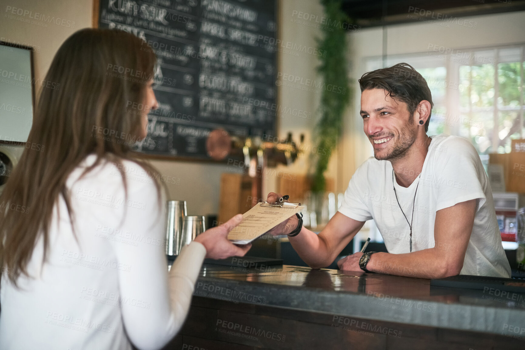 Buy stock photo Man, menu and bartender recommendation for order, service and alcohol at social lounge in nightclub. Barman, smile and customer for liquor, spirits and discount for drinks at happy hour event in pub