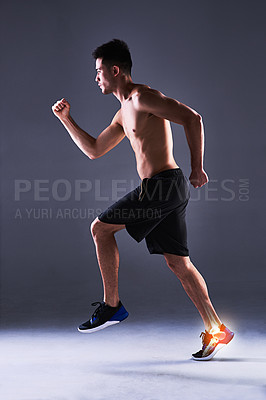 Buy stock photo Man, ankle and injury of exercise in studio, anatomy of leg or foot and xray for diagnosis. Red glow, running and person with inflammation of muscle strain, tension or ache and gray background.