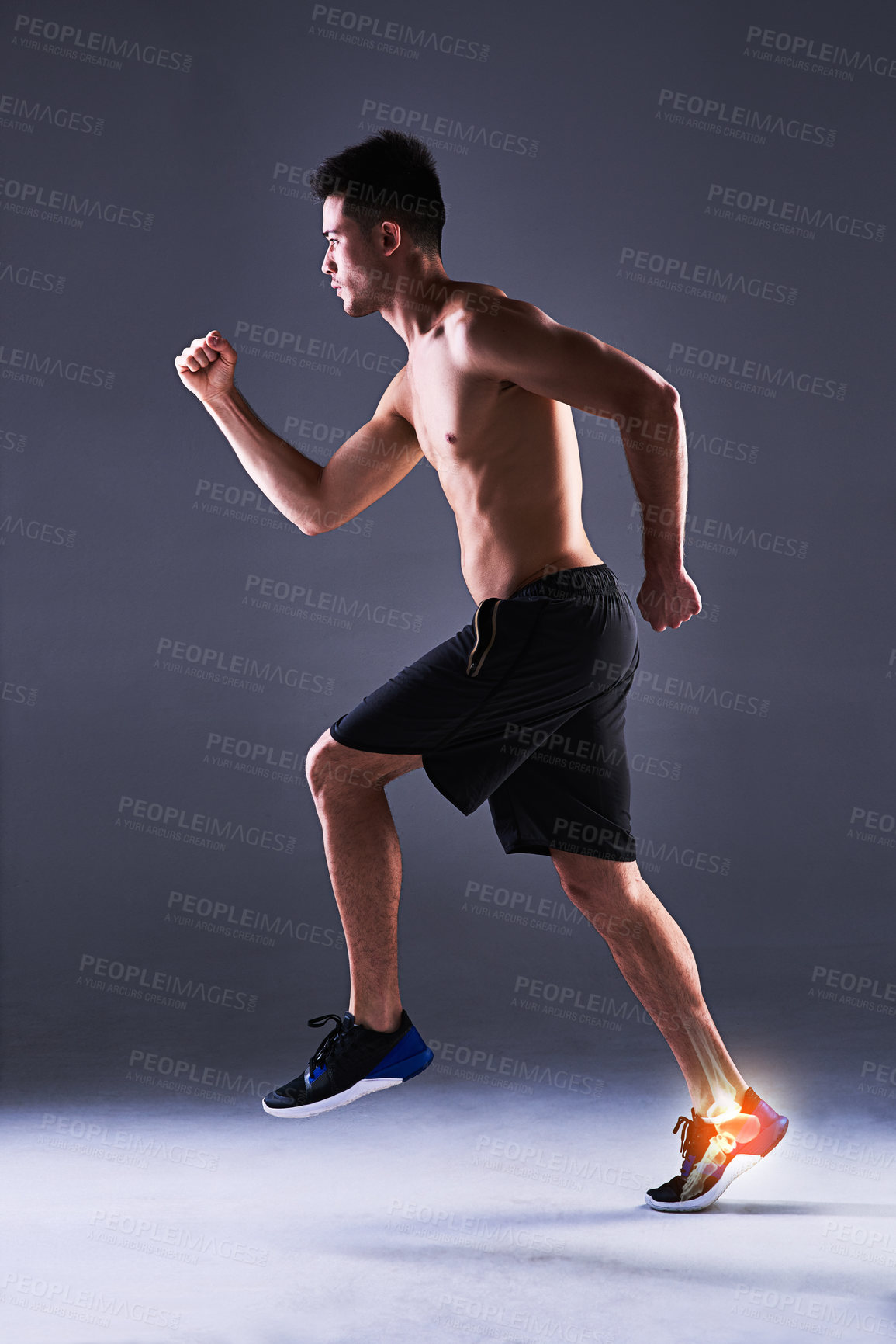 Buy stock photo Man, ankle and injury of exercise in studio, anatomy of leg or foot and xray for diagnosis. Red glow, running and person with inflammation of muscle strain, tension or ache and gray background.