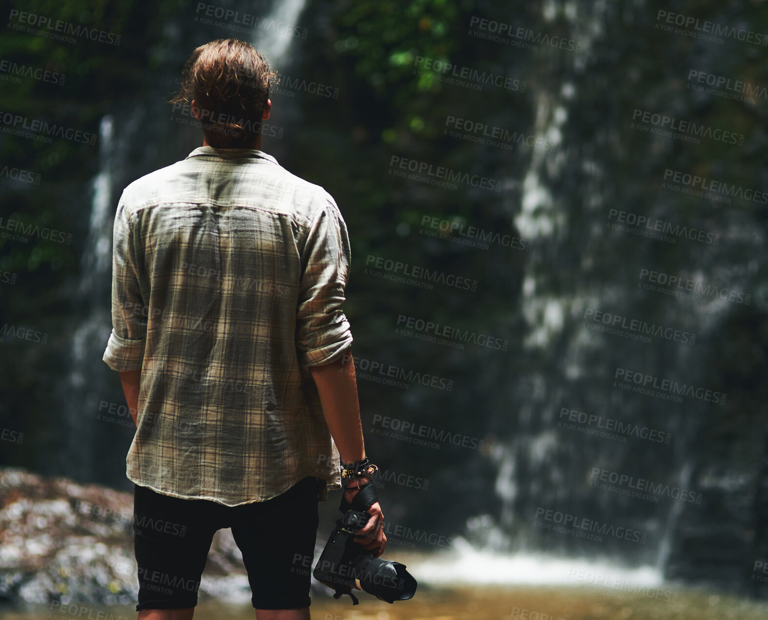 Buy stock photo Back, man and waterfall with camera for photography in Thailand for portfolio, project or magazine. Travel, trip and explore with adventure as photographer or tourist on holiday or vacation at river