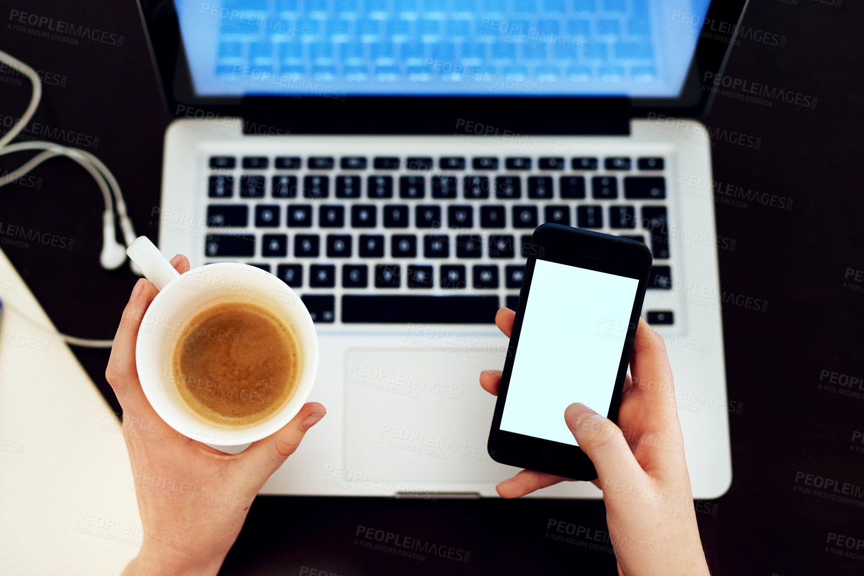 Buy stock photo Hands, laptop and coffee in top view for remote work with smartphone or notebook on black background. Content creator, woman and freelance from above for social media, mockup and brand storytelling