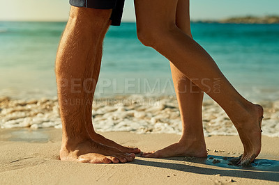 Buy stock photo Legs, sand and couple together at beach for summer vacation, love relationship and outdoor bonding in nature. Lovers, zoom and feet by ocean waves for wellness, travel adventure and honeymoon holiday