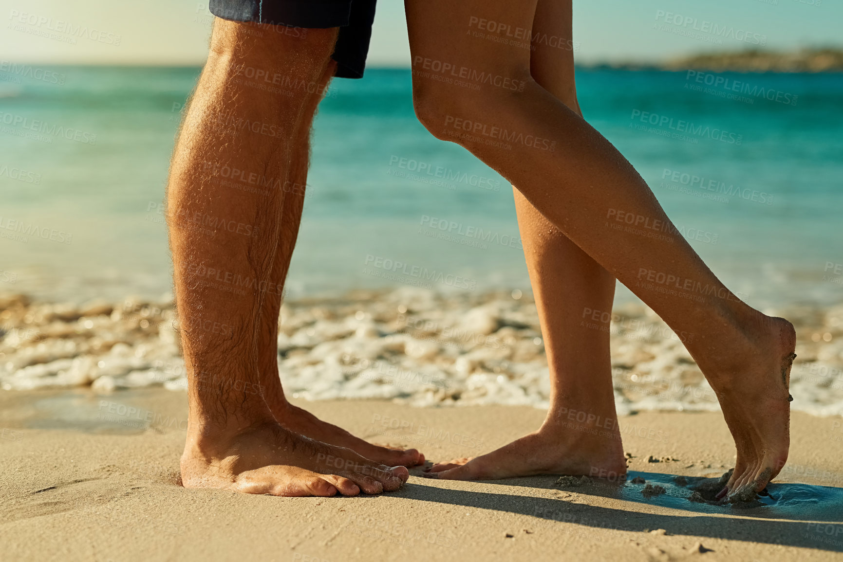 Buy stock photo Legs, sand and couple together at beach for summer vacation, love relationship and outdoor bonding in nature. Lovers, zoom and feet by ocean waves for wellness, travel adventure and honeymoon holiday