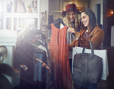 Buy stock photo Smile, customer and women with dress in boutique shop for promotion, sale and discount. Female friends, happy and people checking rack of clothes in fabric, fashion and retail store at indoor mall