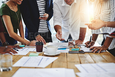 Buy stock photo Shot of a group of unrecognizable people working together in a modern office