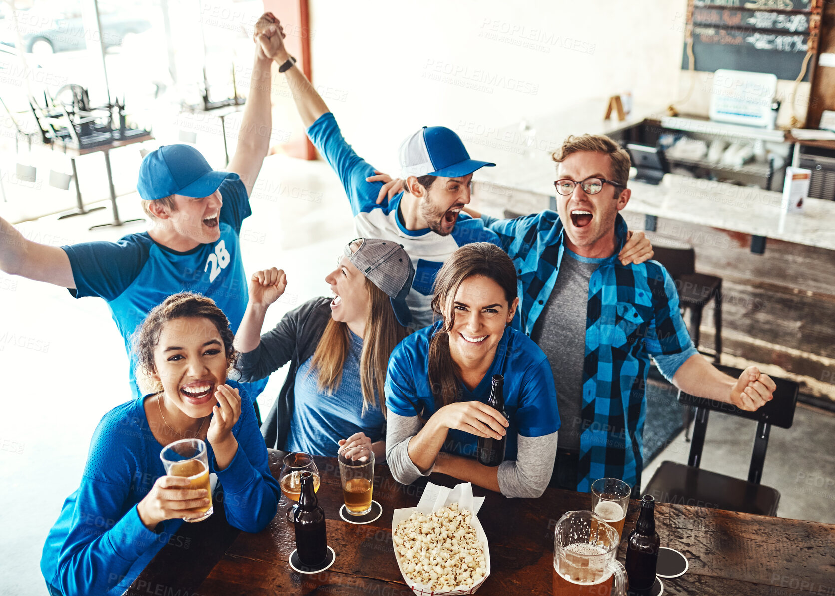 Buy stock photo Sports, celebration and people in pub with beer, smile or happy fans together for world cup on tv. Winning, games and group of excited friends in bar for watch party, drinks or baseball competition