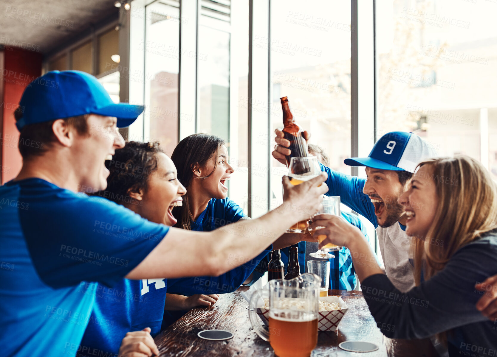 Buy stock photo Celebrate, friends and sports game success, cheers and alcohol for tournament victory of football match. Happy, people and toast beer for winning world cup, celebration and score achievement at pub

