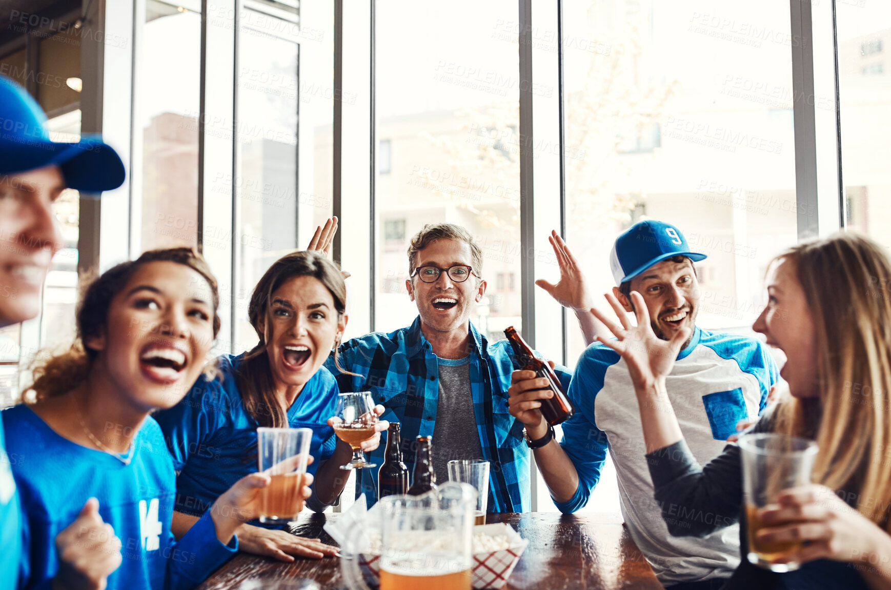 Buy stock photo Sports, fans and together with drinks for celebration, support and people watching tv team game in restaurant. Friends, cheering and live streaming with happiness, excited and pride for baseball win