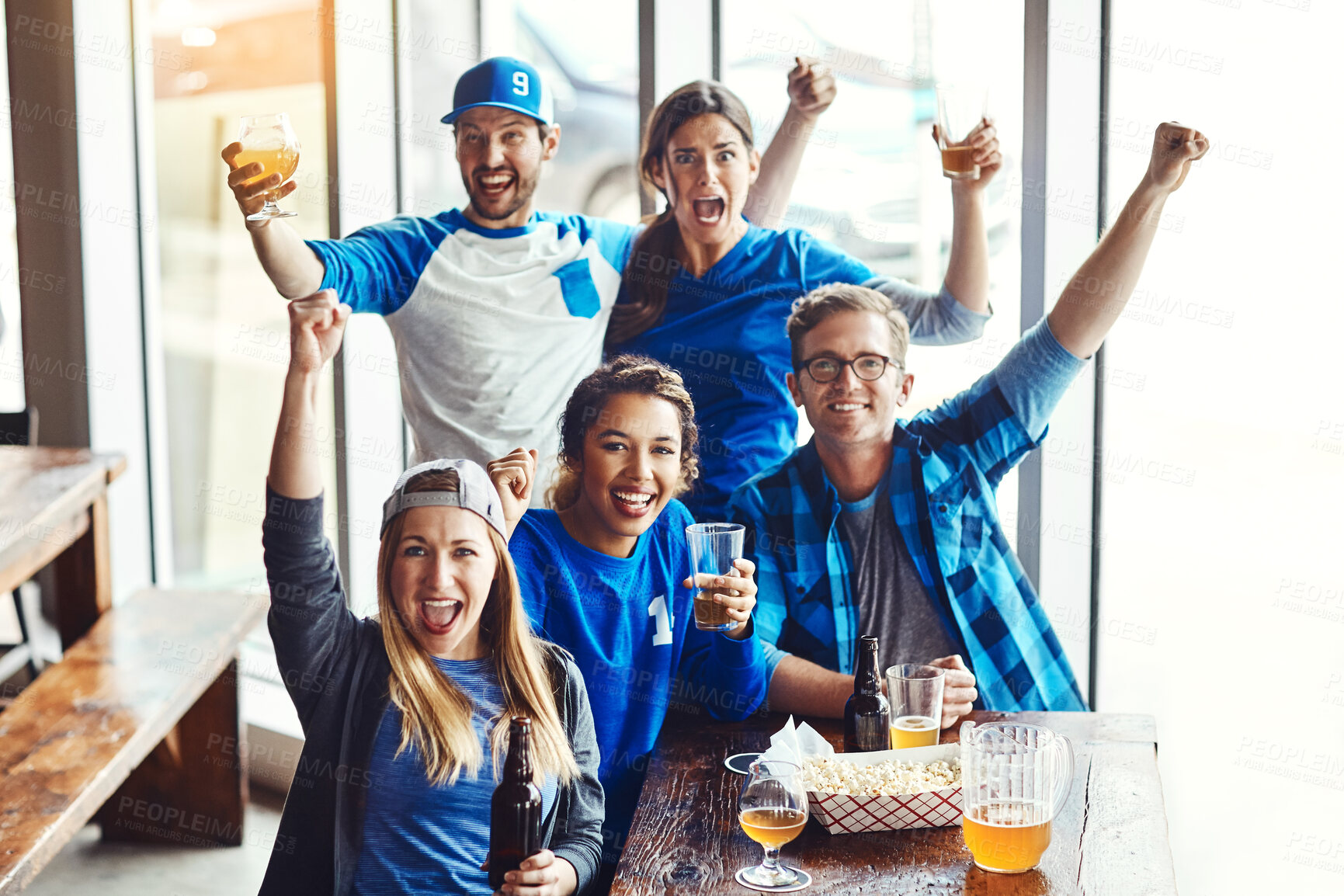 Buy stock photo Portrait, supporters and team at pub, cheering for victory in sports on television with celebration for goal. Group, fans and beer for soccer, tournament or match as friends with loyalty in world cup