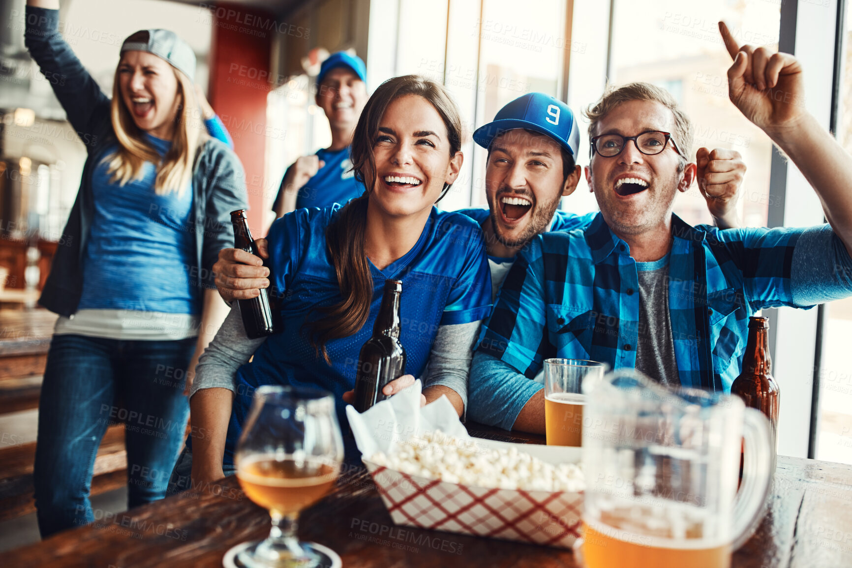 Buy stock photo Happy, friends and sports game success, tournament victory and celebration of football league match event. Men, woman and team support, fan and winning with beer of world cup score achievement at pub