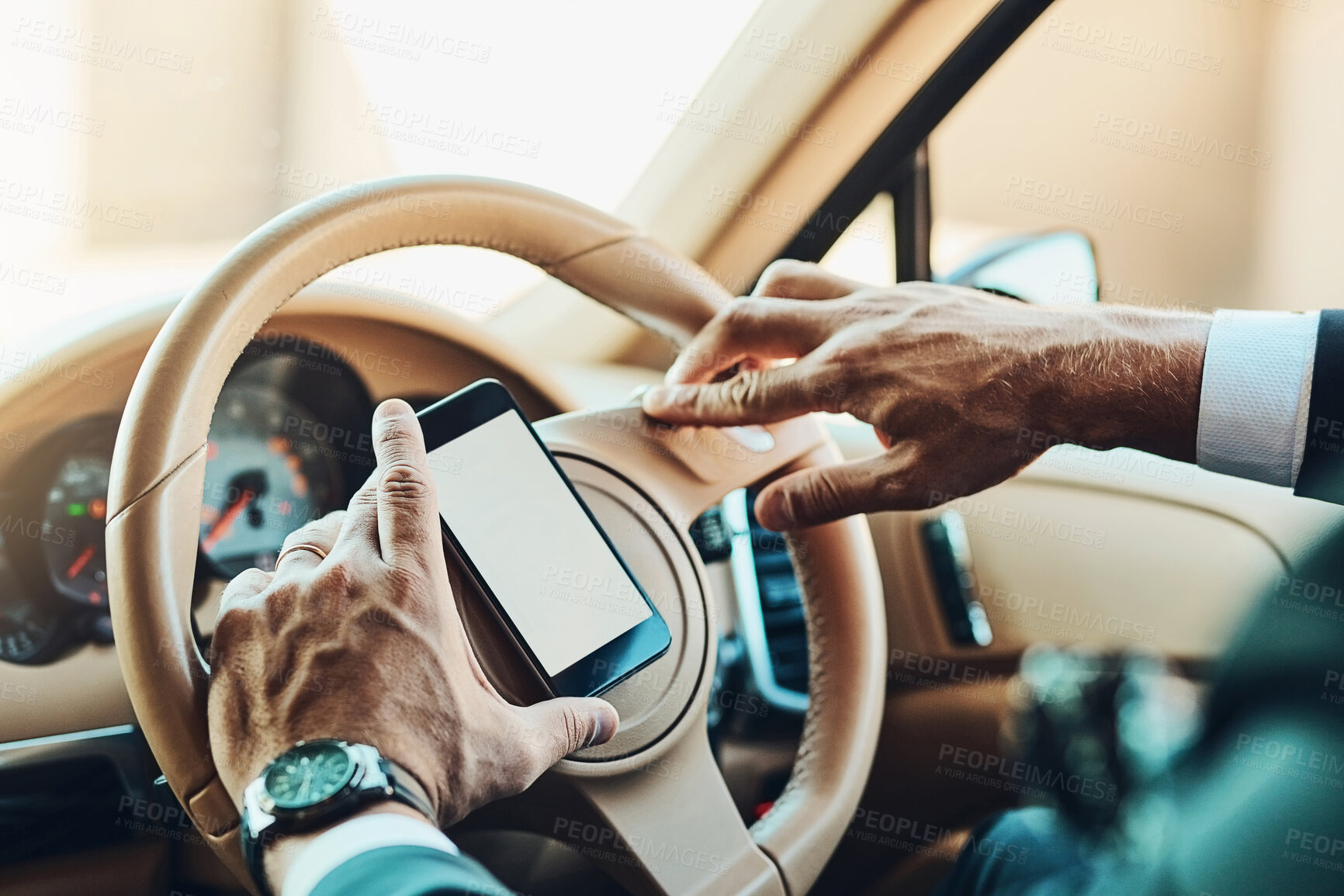 Buy stock photo Cropped shot of an unrecognizable man using a cellphone while driving