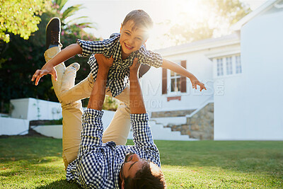 Buy stock photo Shot of a father and son spending the day together outside