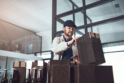 Buy stock photo Courier, tablet and boxes in warehouse with check for beer, stock and inventory for Oktoberfest in Munich. Man, storage and packaging for delivery with alcohol, touchscreen and app for supply chain