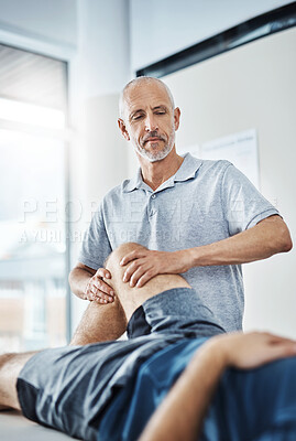 Buy stock photo Men, knee pain and physiotherapist consulting or working, rehabilitation with exercise for wellness. Male people, office and chiropractic for physiotherapy service with health insurance or stretch