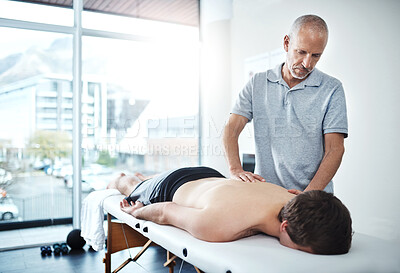 Buy stock photo Man, muscle pain and physiotherapist consulting or working, rehabilitation with exercise for wellness. Male people, office and together for physiotherapy service with health insurance or back support