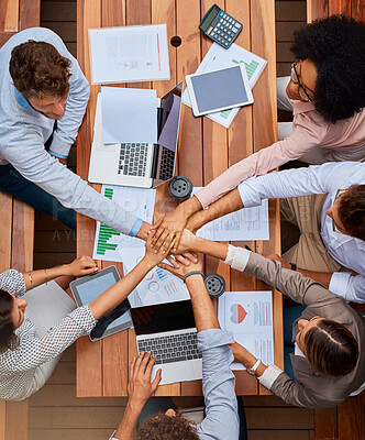 Buy stock photo Teamwork, planning and business people with hands together at workshop for data analysis, stats and tech project. Laptop, paperwork and staff in huddle with charts, graphs or collaboration from above