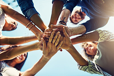 Buy stock photo Hands, low angle and pile for team building with friends outdoor, support and solidarity in nature. Community, mission and partnership, trust and commitment with loyalty, group huddle and agreement