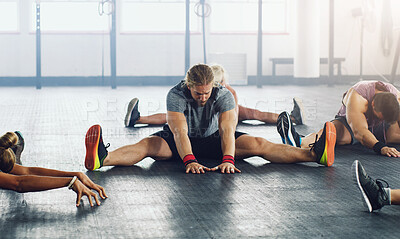 Buy stock photo People, group and stretching together in gym for workout, health and muscle development. Personal trainer, team warm up and sports training for exercise class, strong body and flexibility challenge