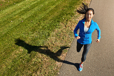 Buy stock photo Asian woman, running and fitness with road for cardio workout, training or outdoor exercise in countryside. Active female person, young athlete or runner in street for sprint, health and wellness