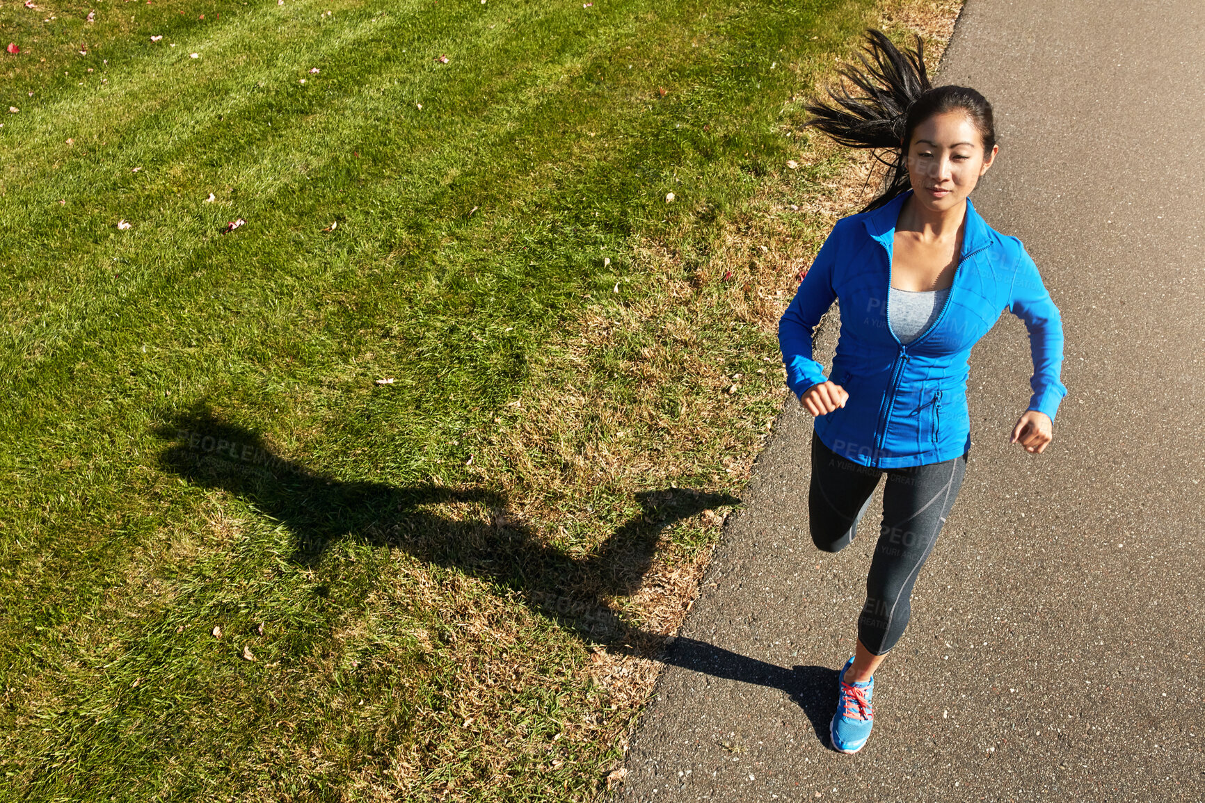 Buy stock photo Asian woman, running and fitness with road for cardio workout, training or outdoor exercise in countryside. Active female person, young athlete or runner in street for sprint, health and wellness