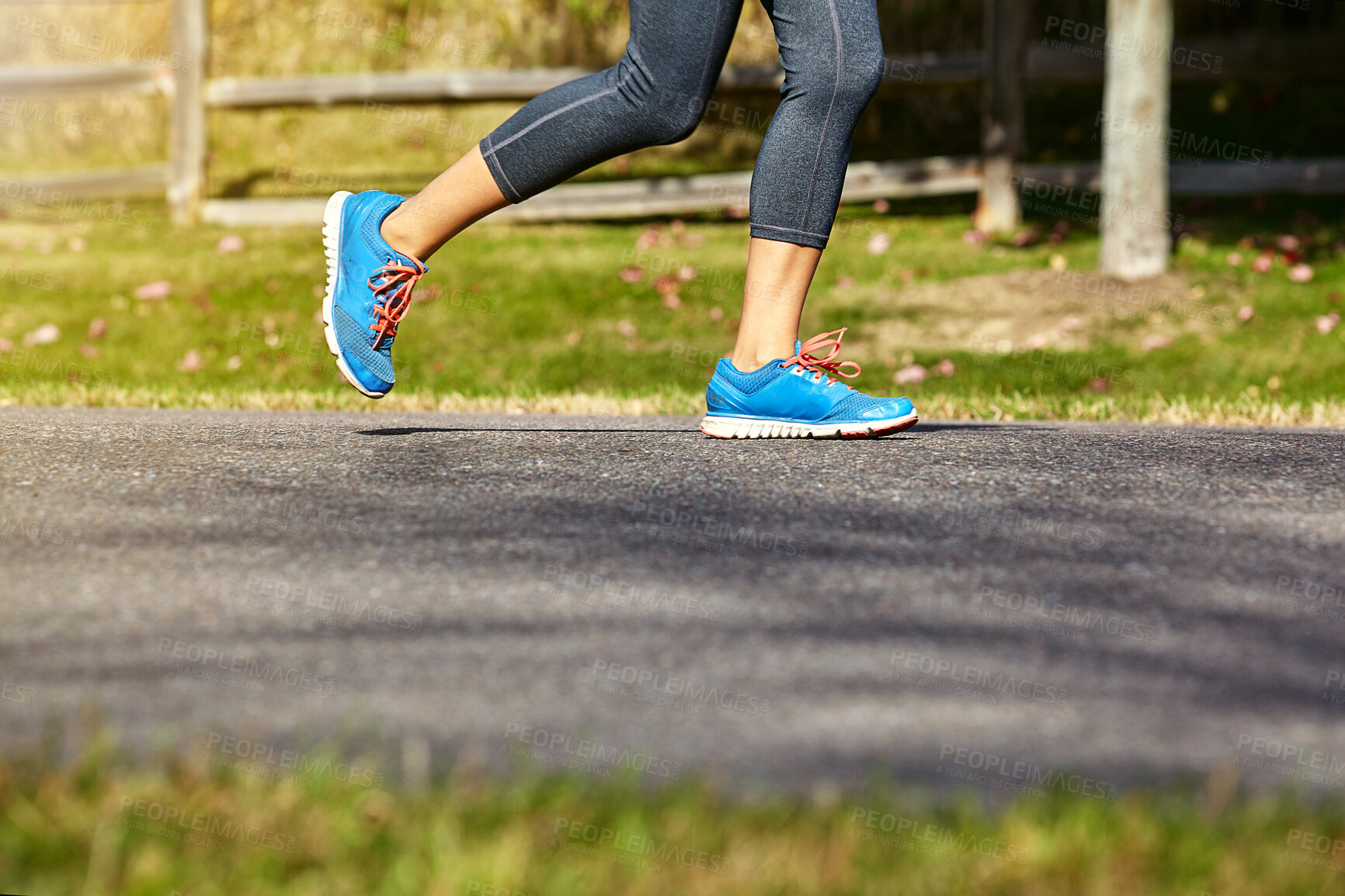 Buy stock photo Person, fitness and running with shoes on road for workout, cardio or outdoor exercise in countryside. Closeup of legs or feet of active athlete or runner with sneakers for sprint or race in nature