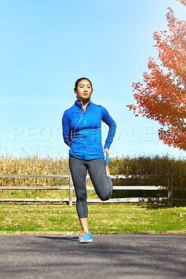 Buy stock photo Asian woman, fitness and stretching with earphones for music, workout or outdoor training in countryside. Female person, athlete or runner in warm up, preparation or getting ready for cardio exercise