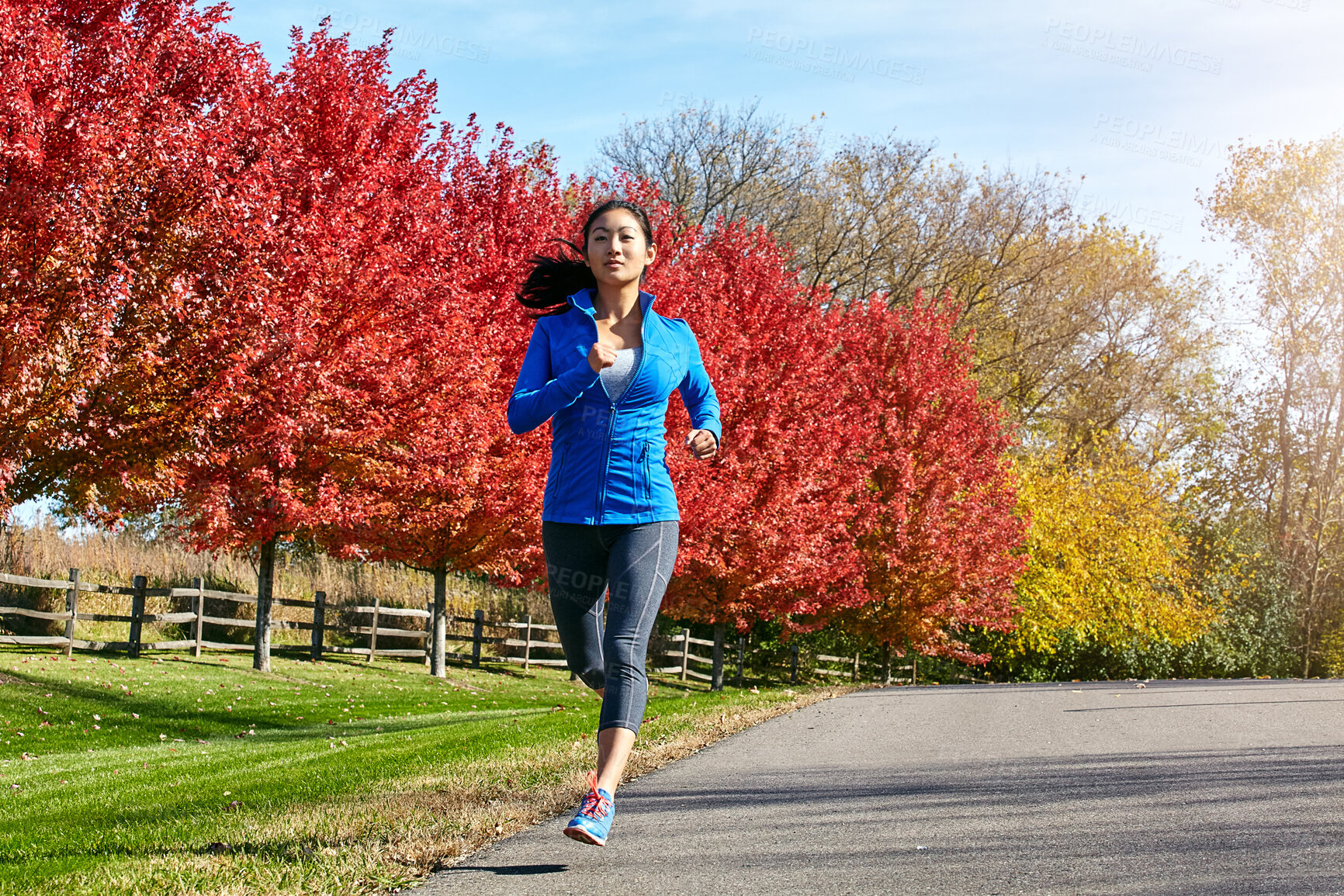 Buy stock photo Fitness, Asian woman and running for workout in nature for cardio exercise or outdoor training in countryside. Active female person, athlete or runner for sprint, health and wellness on autumn road