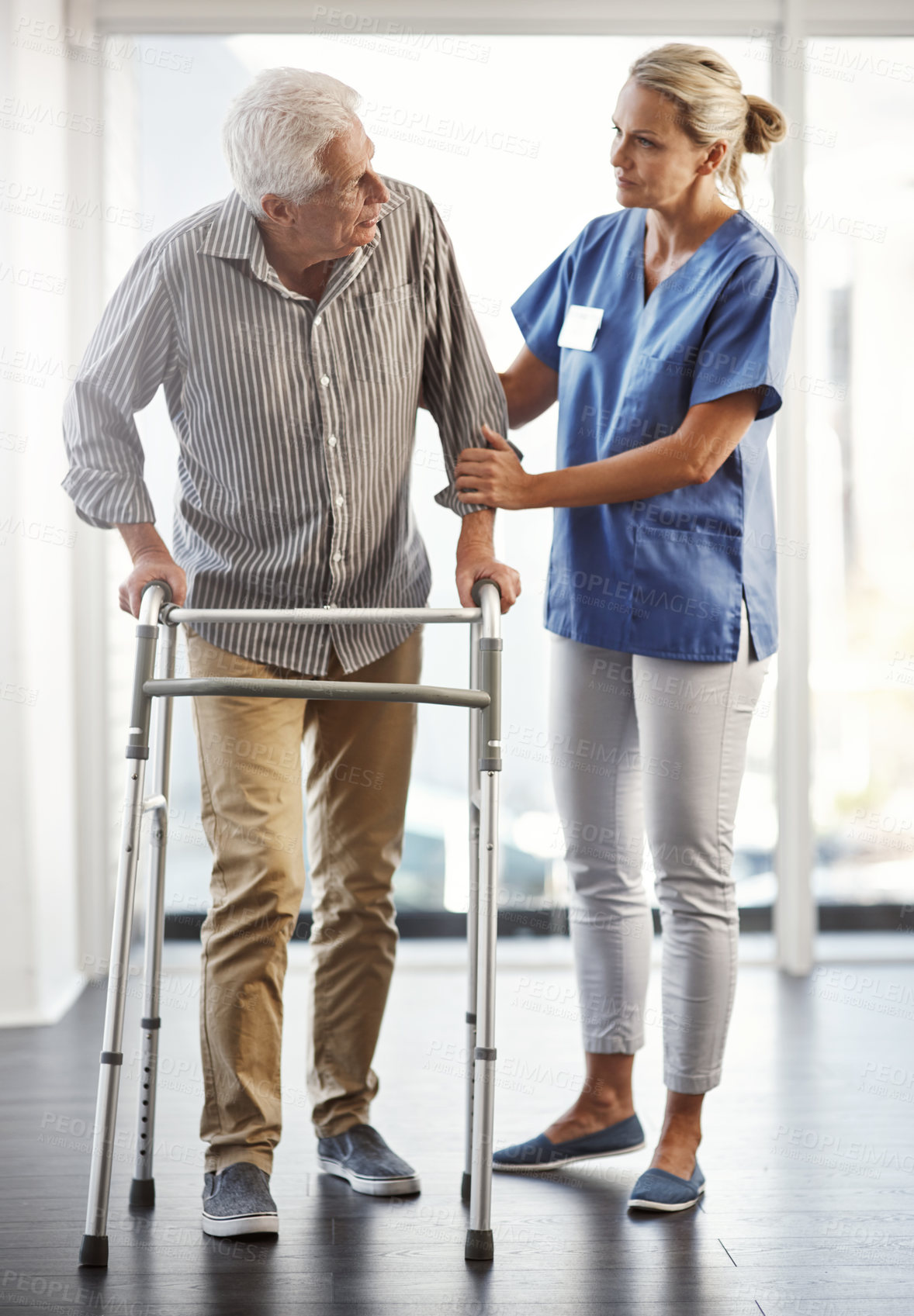 Buy stock photo Senior patient, physiotherapy and walking frame for health care service, retirement and disability support. Medical worker, nurse or physiotherapist helping old man with mobility with rehabilitation