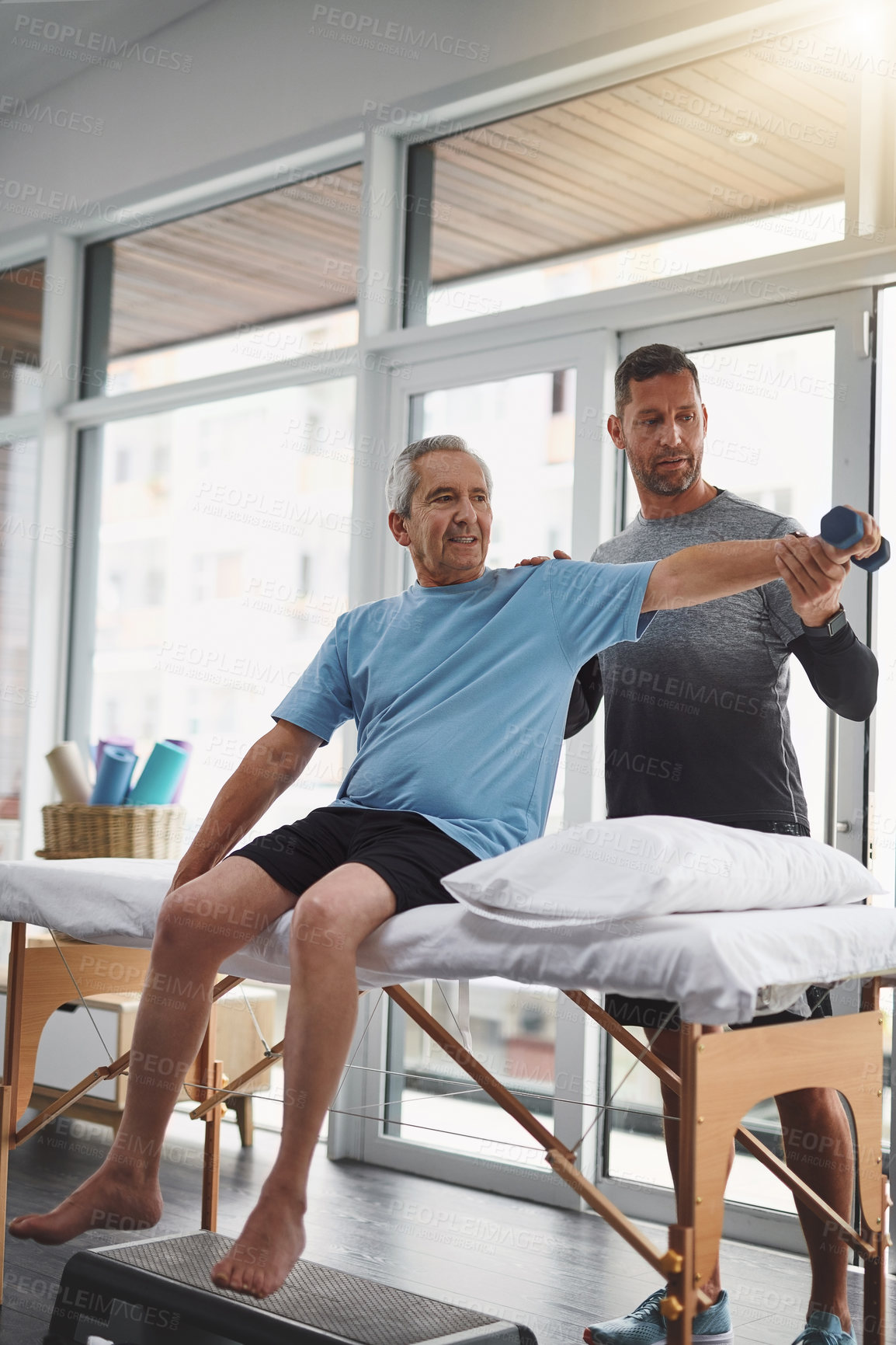 Buy stock photo Physiotherapy, weight and man with senior patient for medical care, consulting and wellness. Chiropractor, healthcare and worker with person for physical therapy, rehabilitation and stretching