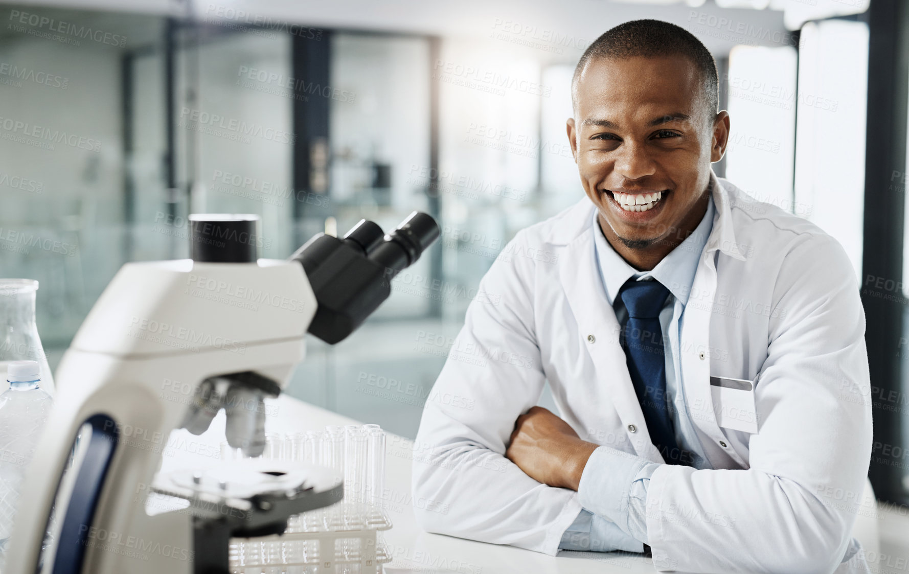 Buy stock photo Smile, laboratory and portrait of black man with microscope, medical study and confidence in science. Biotech, research and happy scientist with pharmaceutical development, internship and pride