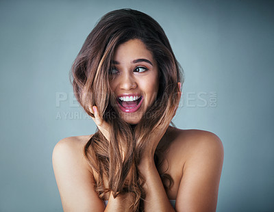 Buy stock photo Laugh, excited and woman in studio with hair care, cosmetic results or luxury shampoo treatment. Benefits, texture and happy girl with hairstyle, keratin therapy and confidence on blue background