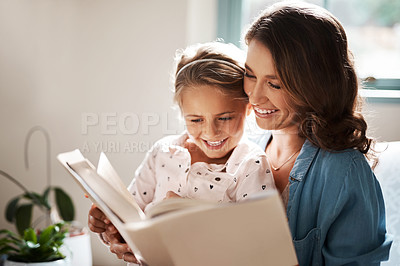 Buy stock photo Mom, girl and smile with storytelling in home for child development, bonding and education. People, parent and kid with care for learning on book reading for knowledge, information and support