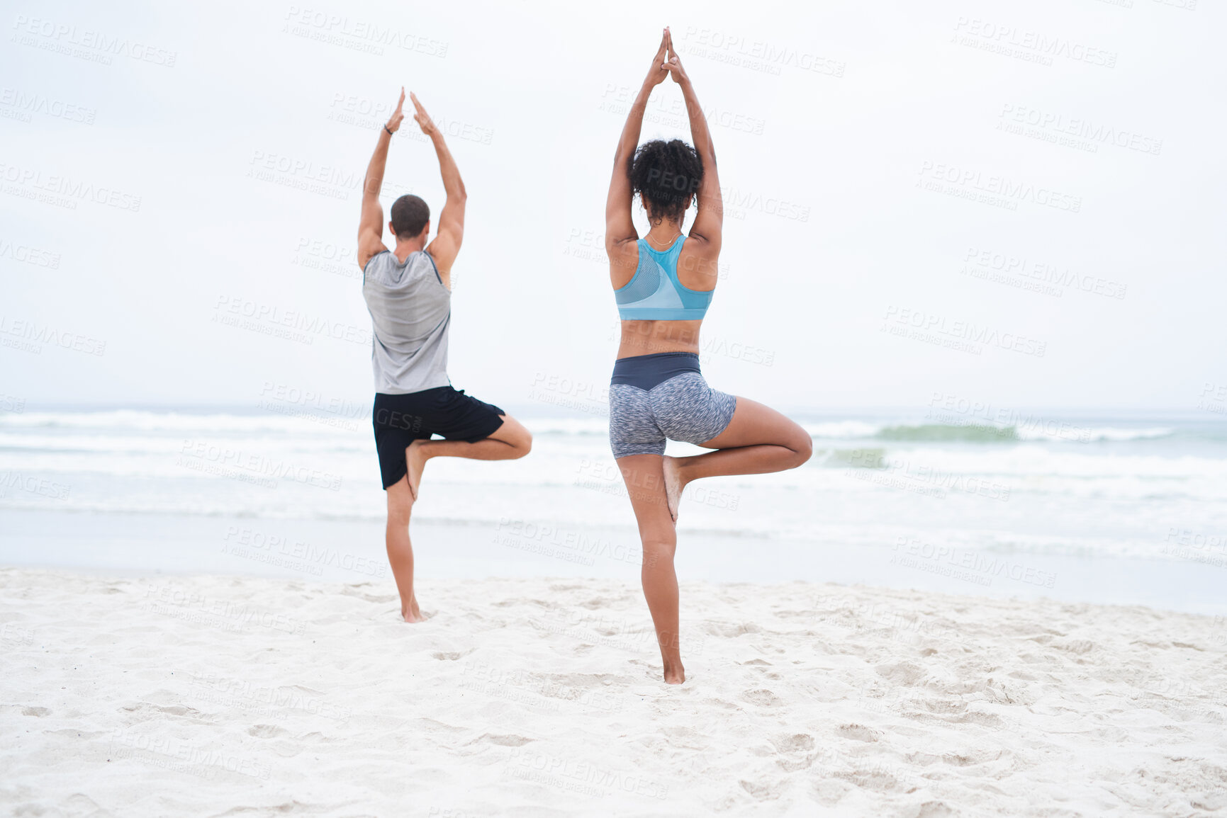 Buy stock photo Back, people and yoga on beach with balance, calm or wellness for mindfulness, wellbeing or health. Couple, outdoor and together in session for physical activity, spiritual practice and stretching