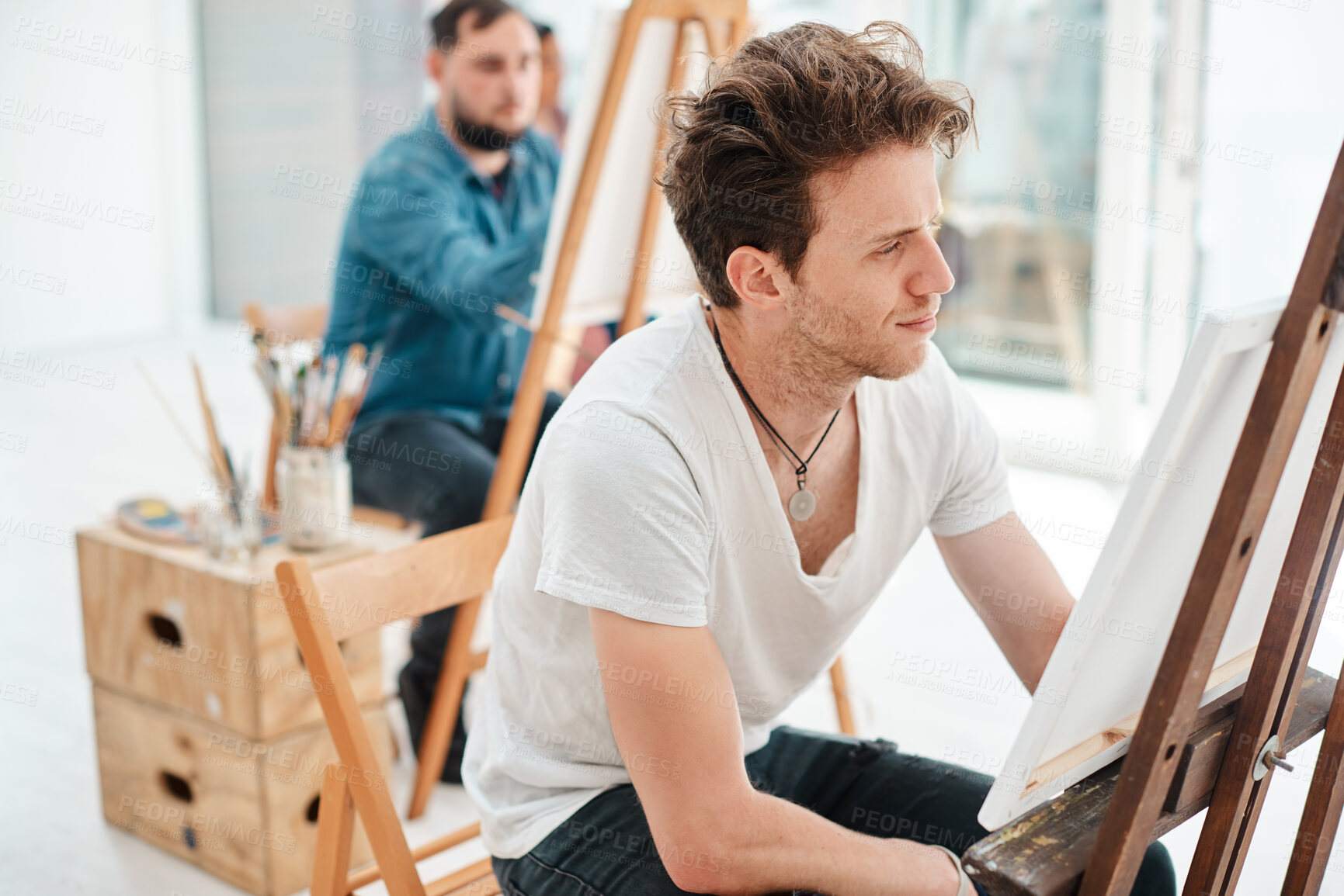 Buy stock photo Student, man and painting in art class with canvas for university project, inspiration or education. Workshop. talent and male artist person with easel for relax, watercolor or creativity in studio