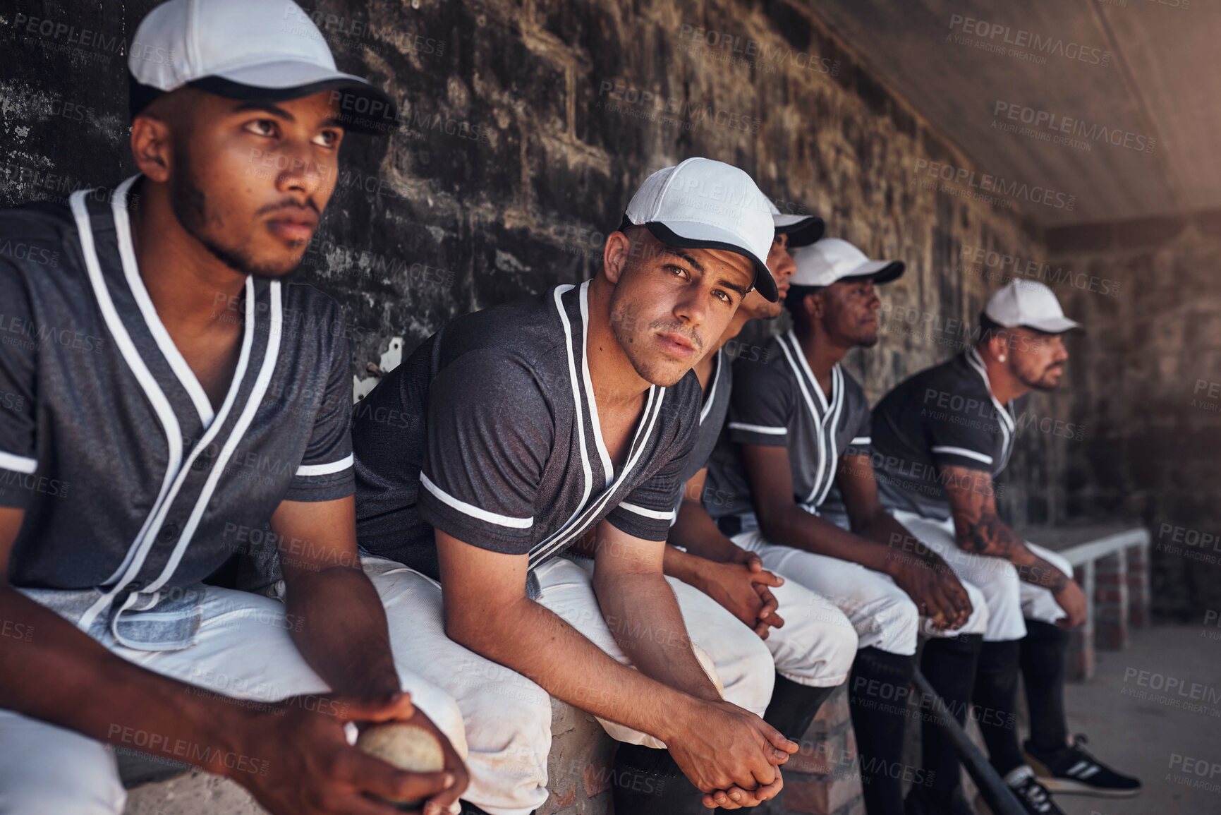 Buy stock photo Baseball, team and dugout for game and watch, anxious and support in shade for competition. Field, diversity and rest for substitution for male people, nervous and athlete for softball club match