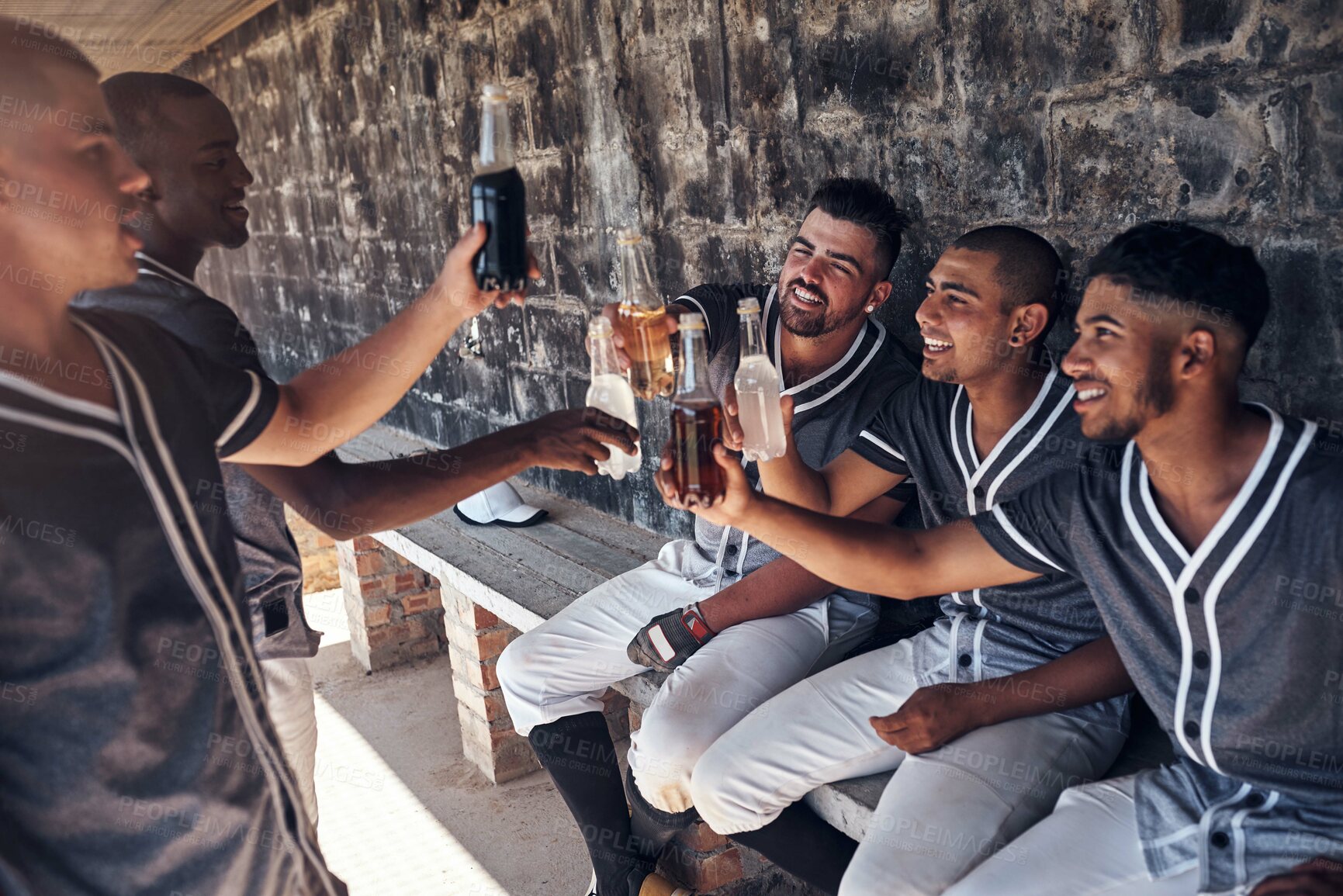 Buy stock photo Baseball, men and team with drinks at stadium, dugout and celebration with toast for success in competition. People, group and friends with soda, winning and cheers with diversity, goals and sports