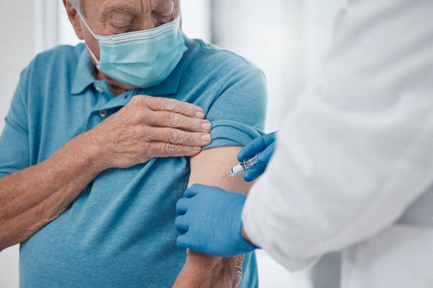 Buy stock photo Senior man, doctor and vaccine in clinic for healthcare, wellness and prevention for virus. Retired male person, injection and medical worker with mask for protection, cure and safety in hospital