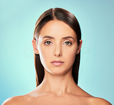 Buy stock photo Skincare, portrait and woman in studio for cosmetics, facial treatment or natural glow on blue background. Body, aesthetic and female model with confidence for beauty, salon care or wellness