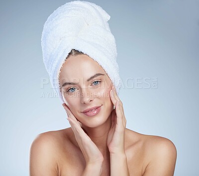 Buy stock photo Hands, woman and portrait for skincare with towel, natural shine and wellness by studio background. Model, dermatology and spa aesthetic for skin health, salon treatment and beauty with face touch