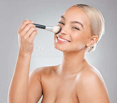 Buy stock photo Woman, makeup brush and laugh in studio portrait with powder, nose and cosmetics by white background. Girl, person and model with tools for application, test and happy for beauty with facial change