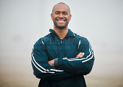 Buy stock photo Happy man, portrait and sports coach with confidence on turf for fitness, health and wellness on outdoor field. Young male person or professional athlete with smile or arms crossed in winter mist